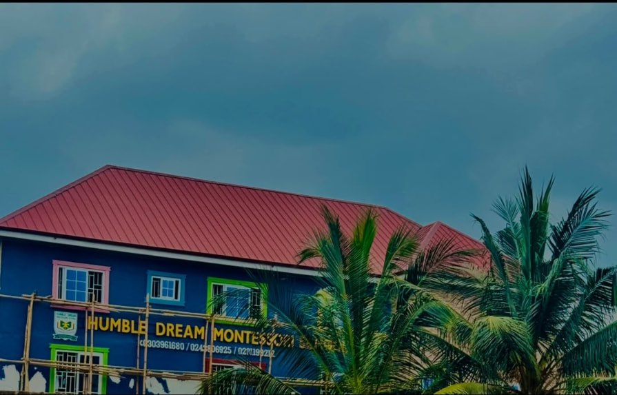 Humble Dream Montessori School building surrounded by palm trees